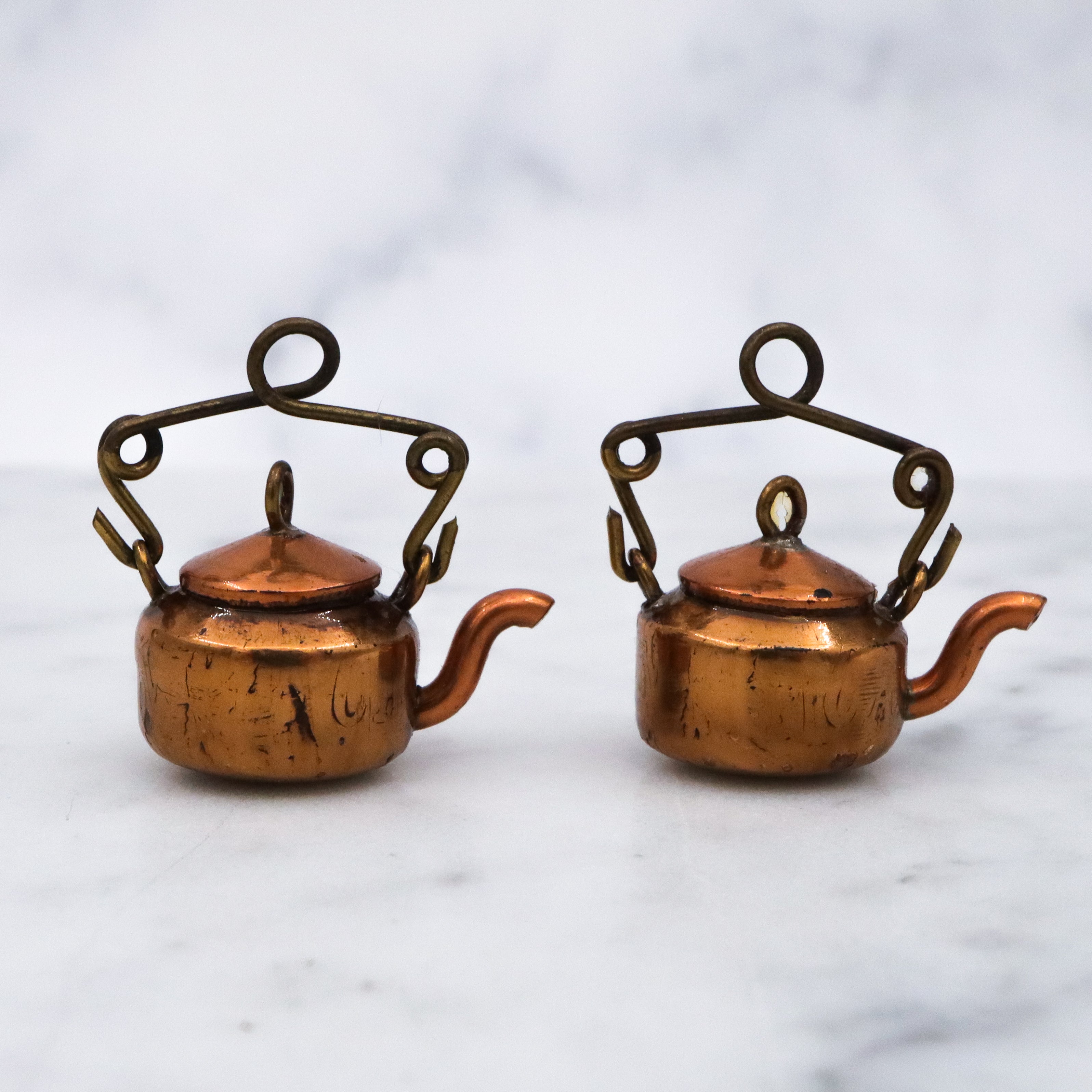 Pair of antique early 20th century prisoner made wheat penny copper tea kettles
